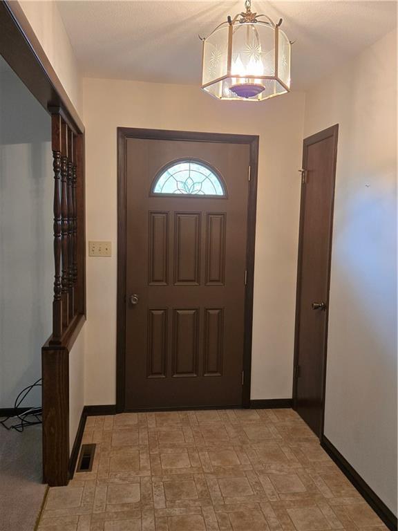 2213 Millwood Dr, Atchison, KS 66002 - entrance foyer featuring baseboards