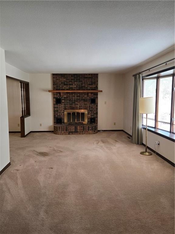 2213 Millwood Dr, Atchison, KS 66002 - unfurnished living room featuring light colored carpet and a fireplace