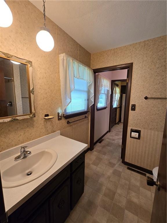 2213 Millwood Dr, Atchison, KS 66002 - full bath featuring vanity, tile patterned floors, and a shower