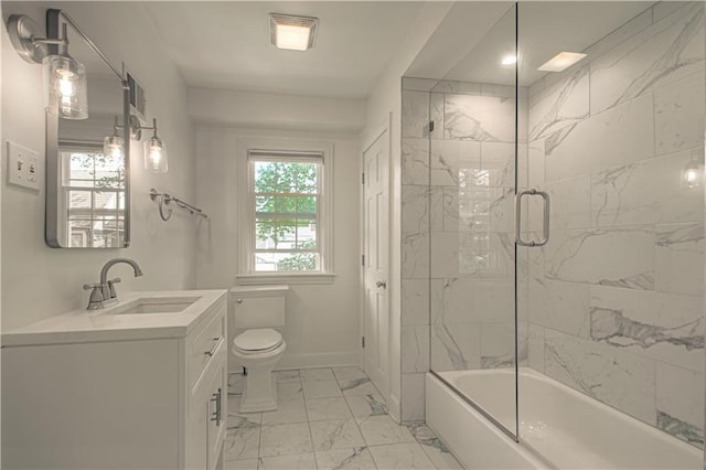 bathroom featuring vanity, baseboards, shower / bath combination with glass door, toilet, and marble finish floor