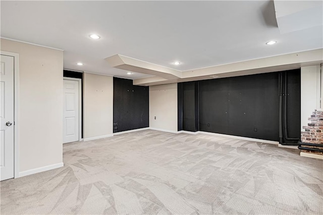 finished below grade area with recessed lighting, light colored carpet, and baseboards