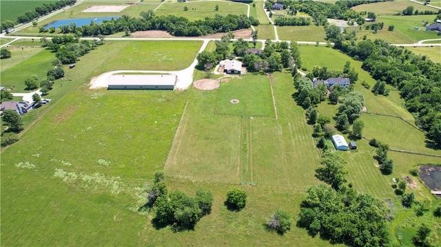 aerial view with a rural view and a water view