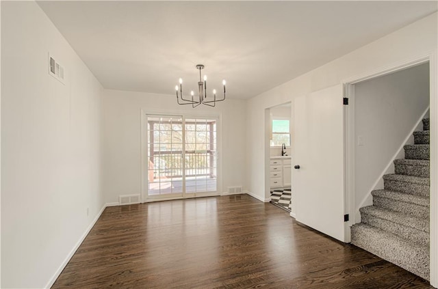 interior space with visible vents, stairs, dark wood-style floors, a notable chandelier, and a sink