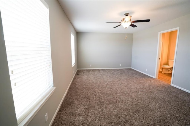 unfurnished room featuring baseboards, a ceiling fan, and carpet