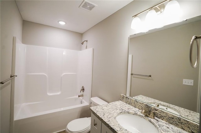 bathroom with visible vents, toilet, bathtub / shower combination, and vanity