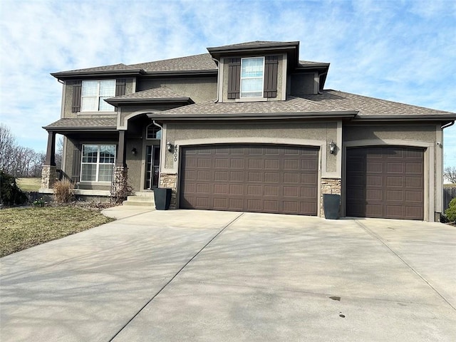 prairie-style home featuring stucco siding, stone siding, a garage, and concrete driveway