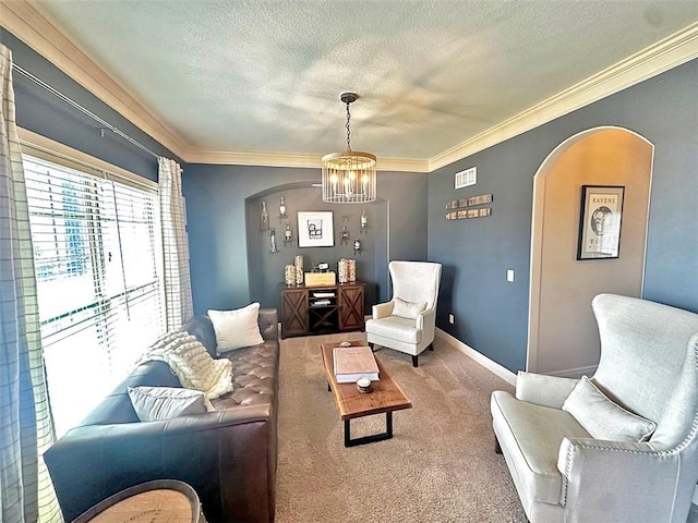 living area with baseboards, ornamental molding, carpet flooring, arched walkways, and a textured ceiling