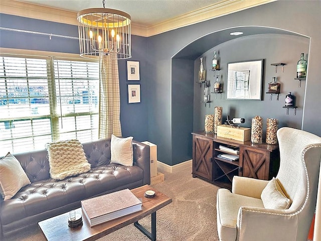 carpeted living area featuring a wealth of natural light, a chandelier, baseboards, and ornamental molding