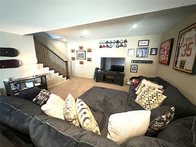 carpeted living room with baseboards and stairs