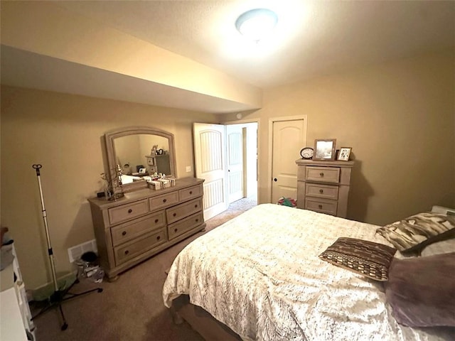 bedroom featuring visible vents and carpet floors