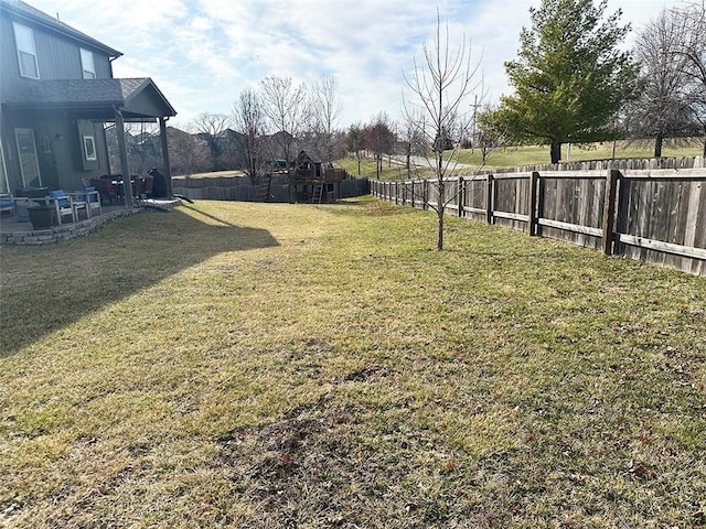 view of yard featuring a patio and a fenced backyard