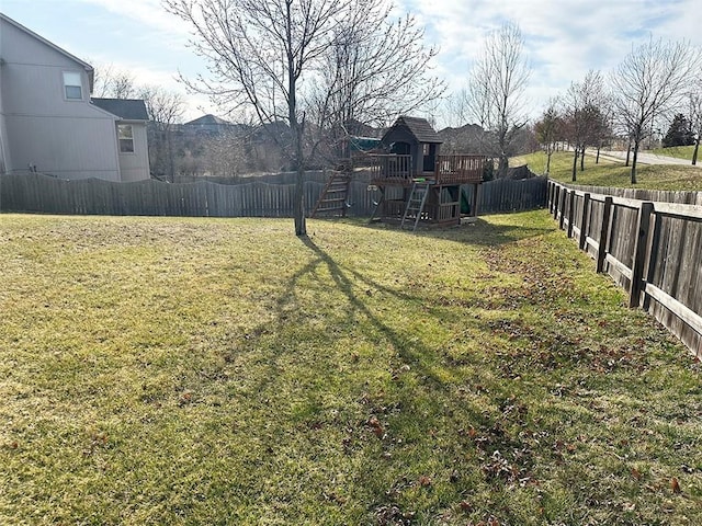 view of yard with a fenced backyard and a wooden deck