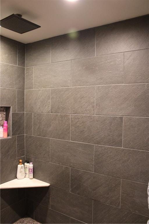 full bathroom with a tile shower