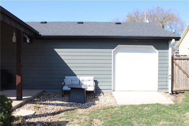 exterior space with fence and a garage