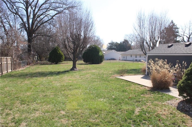 view of yard featuring a patio area and fence