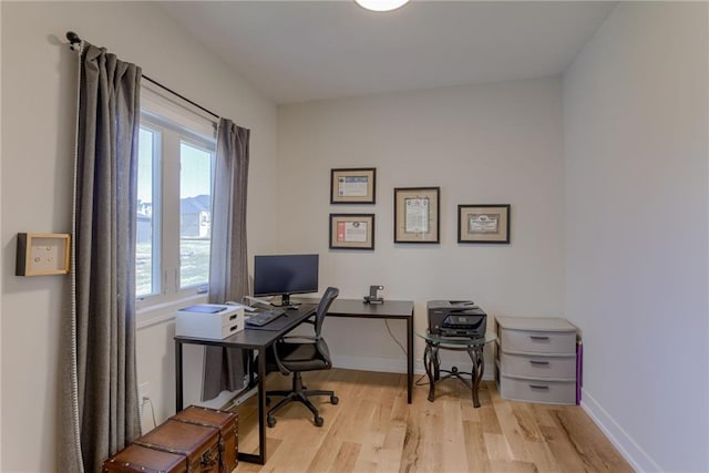 office with wood finished floors and baseboards