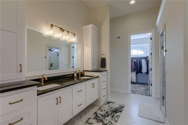 full bathroom featuring vanity, visible vents, marble finish floor, and a stall shower