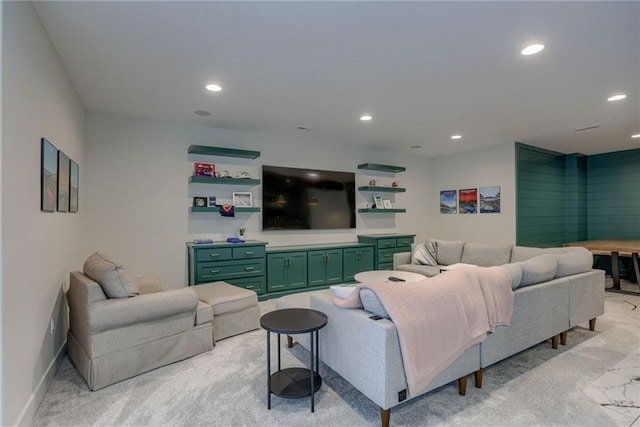 living area with recessed lighting, baseboards, and light carpet