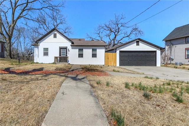 view of front of house featuring an outbuilding, board and batten siding, and a garage