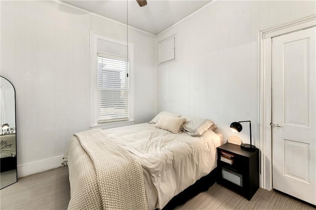 bedroom featuring baseboards and ceiling fan