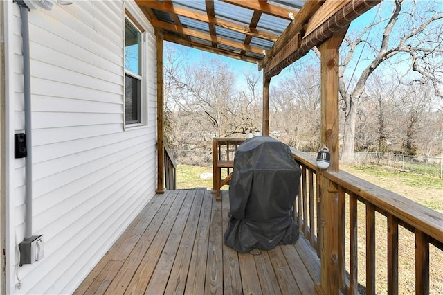 wooden terrace with a pergola and fence