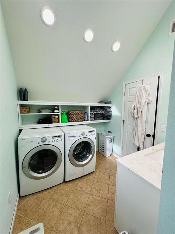 laundry room with washing machine and dryer, recessed lighting, laundry area, and light tile patterned floors