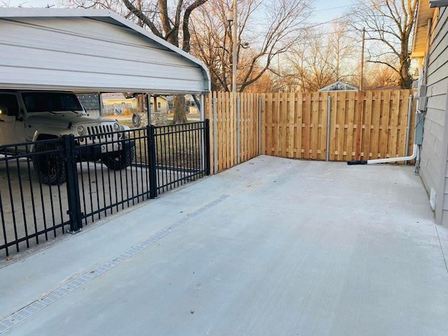 exterior space featuring fence and a detached carport