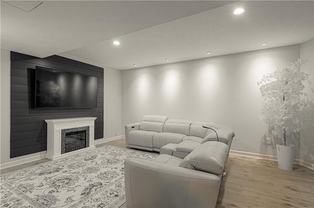 living room with recessed lighting, wood finished floors, and baseboards