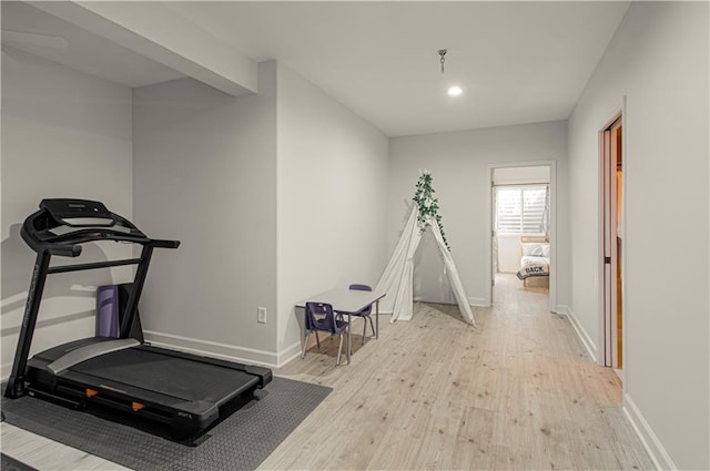 workout area with recessed lighting, wood finished floors, and baseboards