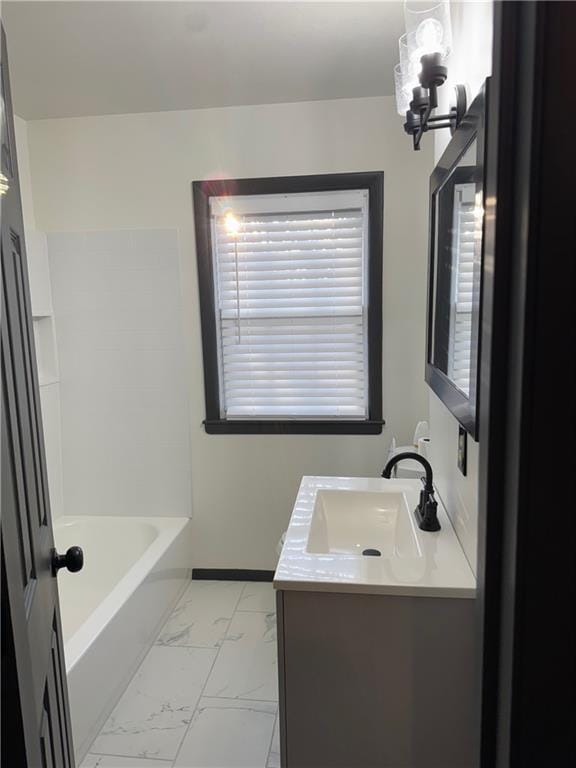 bathroom with walk in shower, a washtub, a notable chandelier, marble finish floor, and vanity