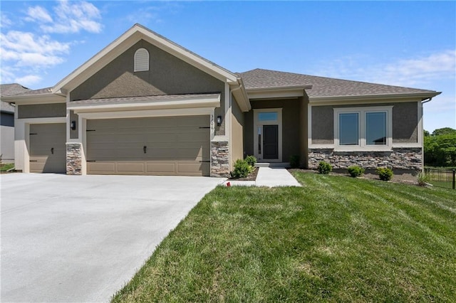 view of front of house with an attached garage, stone siding, and stucco siding