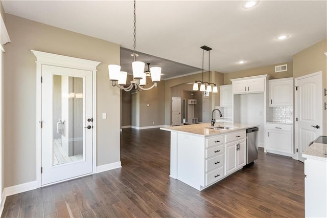 kitchen with visible vents, a chandelier, dishwasher, white cabinetry, and a sink