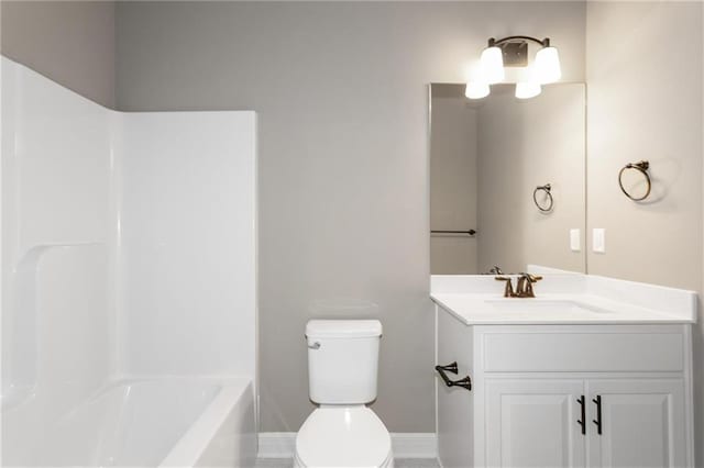 full bath featuring vanity, shower / tub combination, toilet, and baseboards