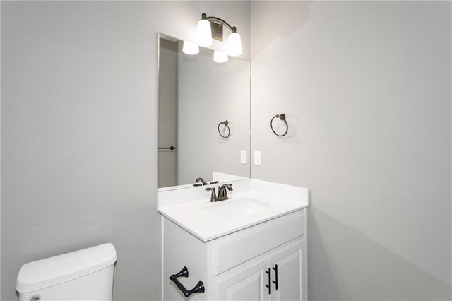 bathroom with toilet and vanity