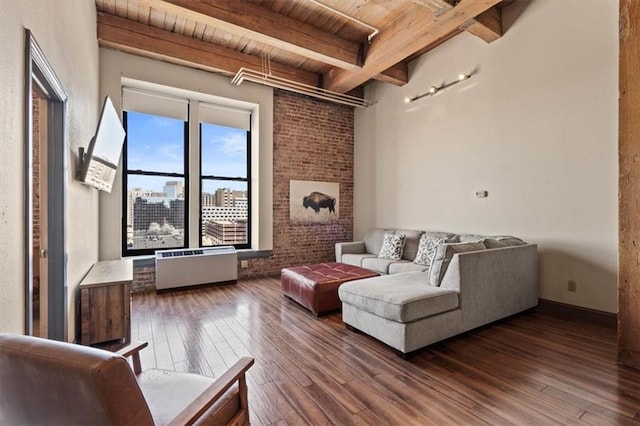 living area with hardwood / wood-style floors, wood ceiling, and beamed ceiling