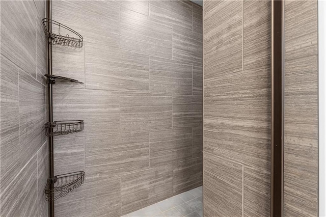 bathroom with a tile shower