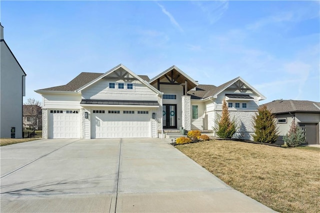 view of front of property featuring driveway, metal roof, a standing seam roof, and a front yard