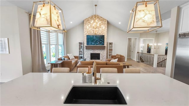 kitchen with a sink, a notable chandelier, and light countertops