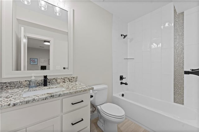 full bath with toilet,  shower combination, and vanity