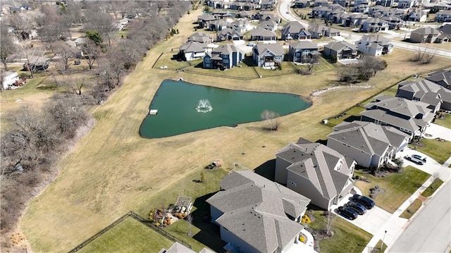 birds eye view of property featuring a residential view and a water view