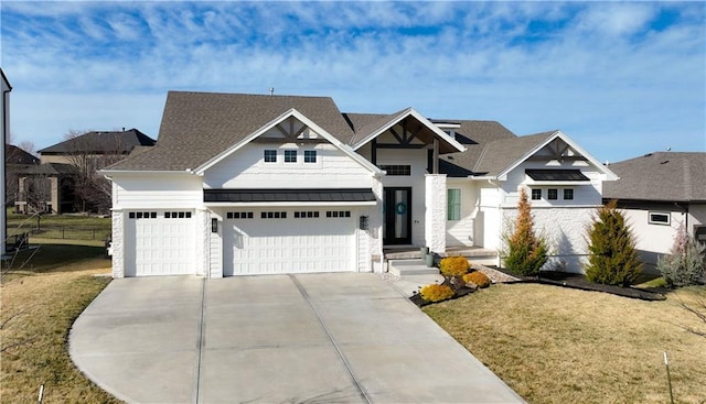 craftsman-style home with a front lawn, a standing seam roof, metal roof, concrete driveway, and a garage