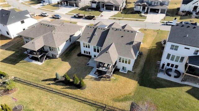 birds eye view of property with a residential view