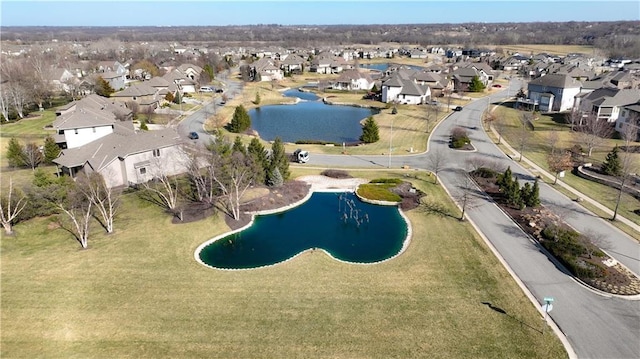 aerial view with a residential view and a water view