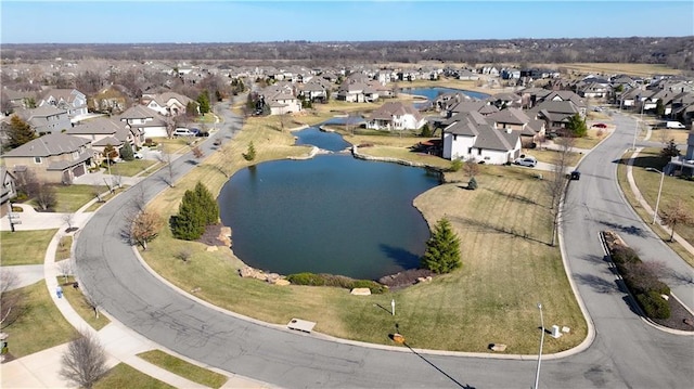 bird's eye view featuring a residential view and a water view