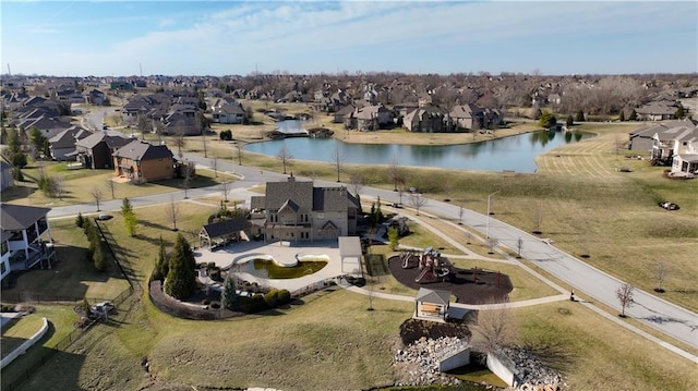 drone / aerial view with a residential view and a water view