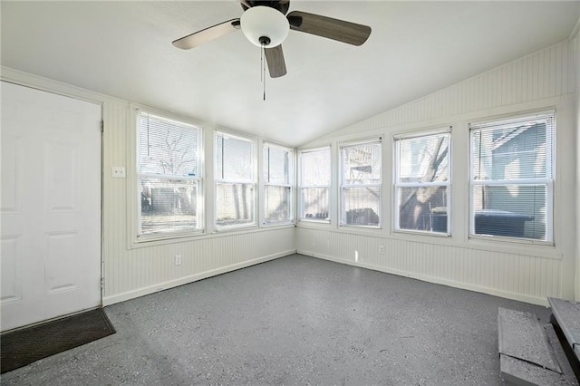 unfurnished sunroom with lofted ceiling and a ceiling fan