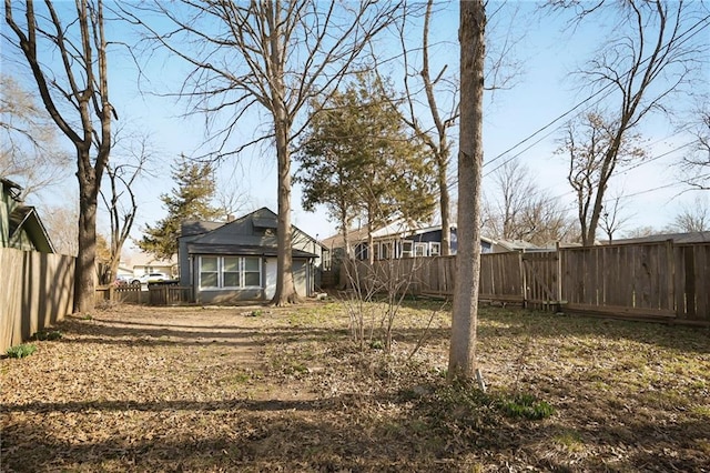 view of yard with a fenced backyard