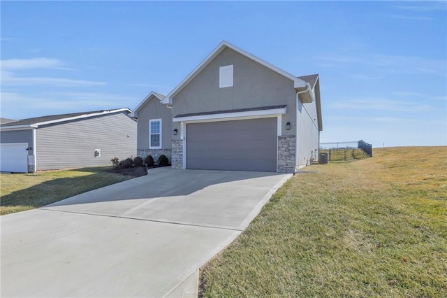 ranch-style home with stucco siding, driveway, a front lawn, stone siding, and an attached garage