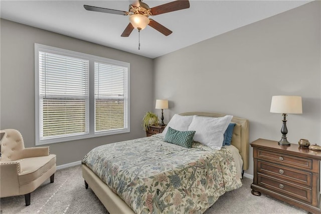 bedroom with baseboards, carpet floors, and ceiling fan