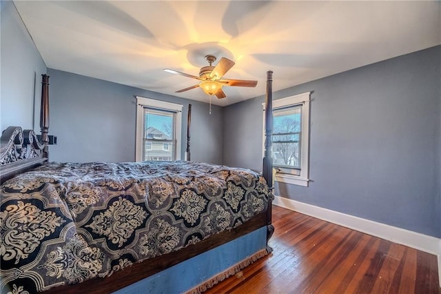 bedroom with baseboards, ceiling fan, and hardwood / wood-style flooring